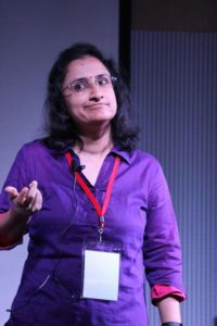 Radhika Nathan speaking at an event